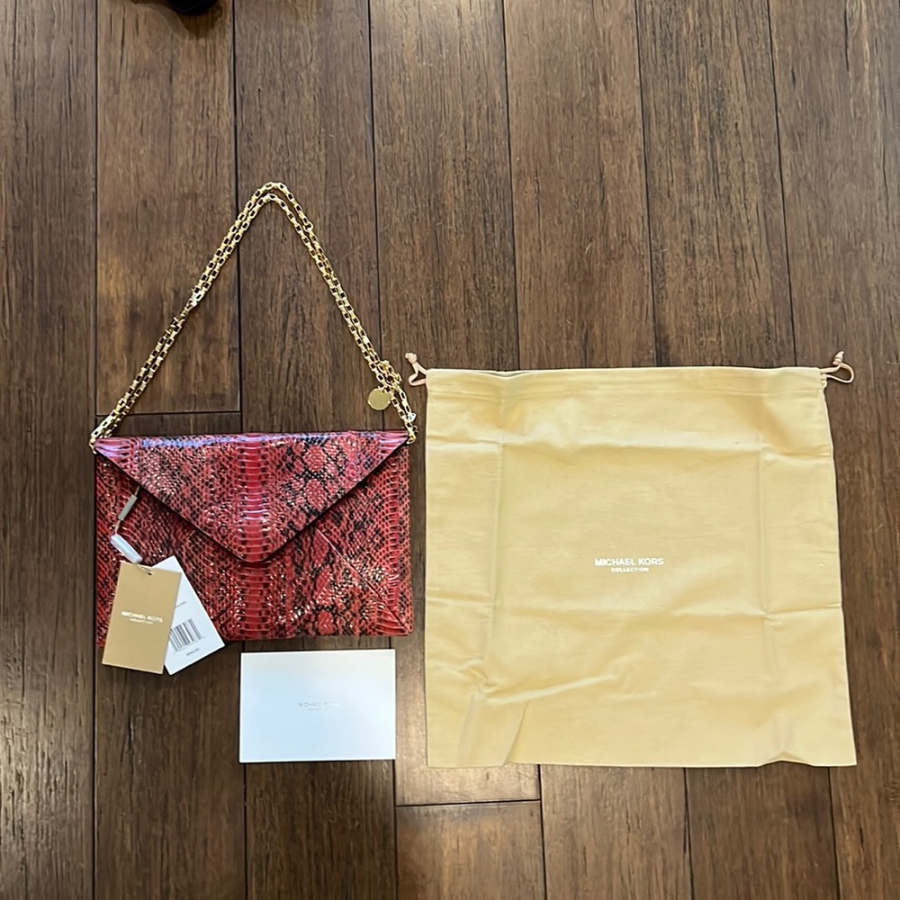 Michael Kors envelope clutch. Adjustable and removable gold chain! NWT!